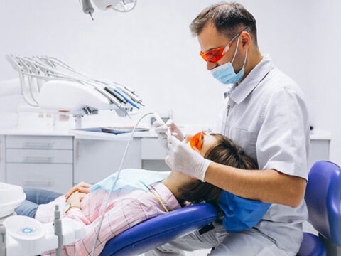How does a root canal restore oral health after infection?
